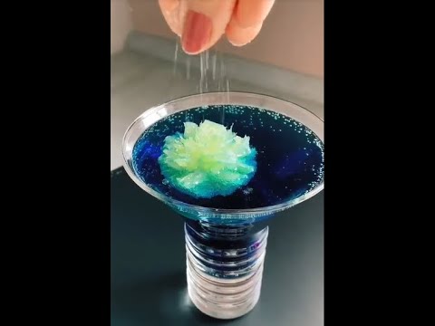 cocktail with blue curacao and vodka and lemonade and lime grenadine syrup